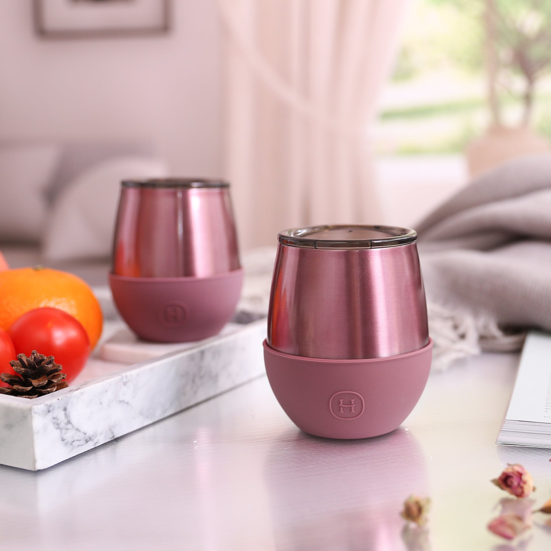 HYDY 8 oz rose gold tumbler in dusty rose color, showing a sleek stainless steel design with a lid and straw.
