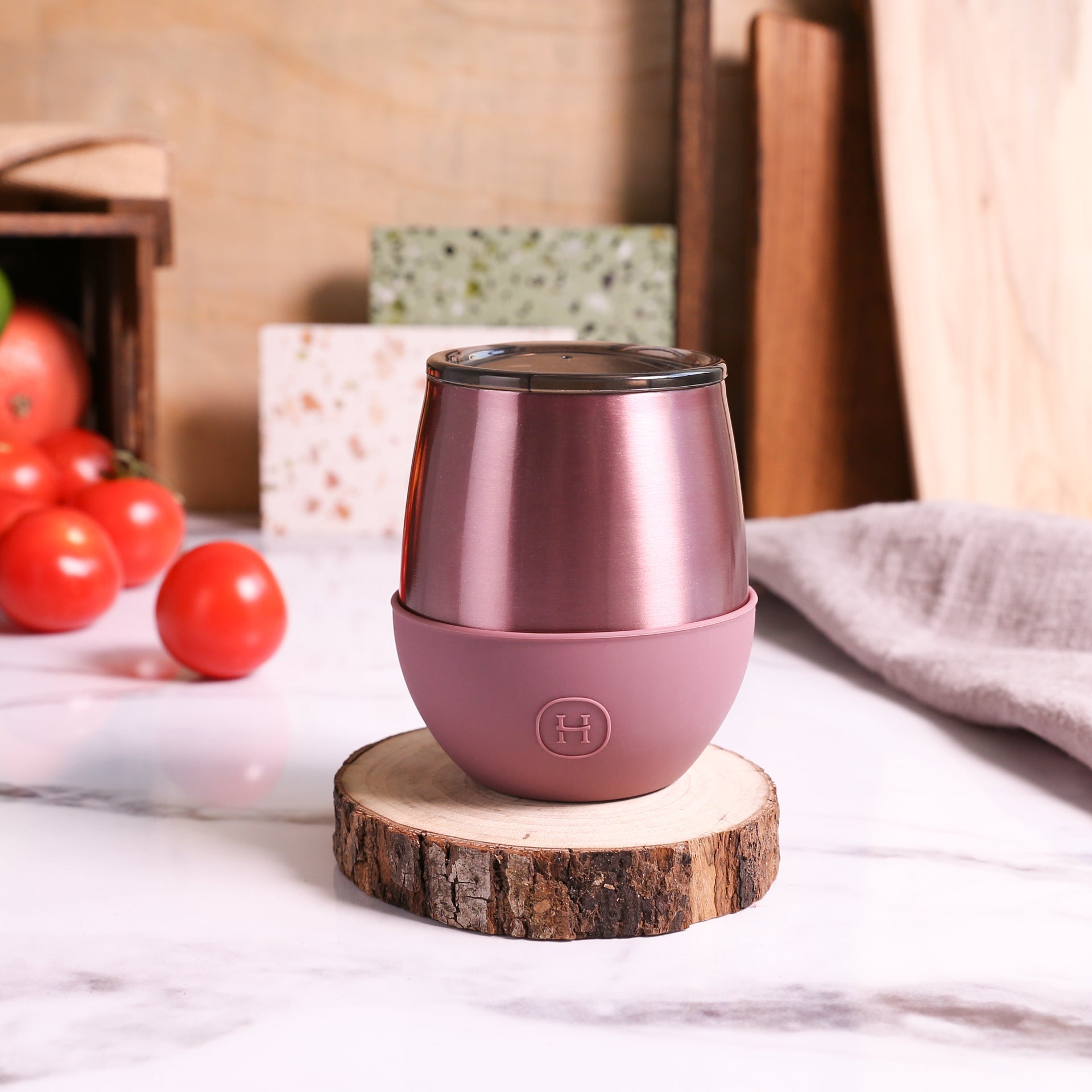 HYDY 8 oz rose gold tumbler in dusty rose color with a sleek design and stainless steel body, ideal for hot and cold beverages.