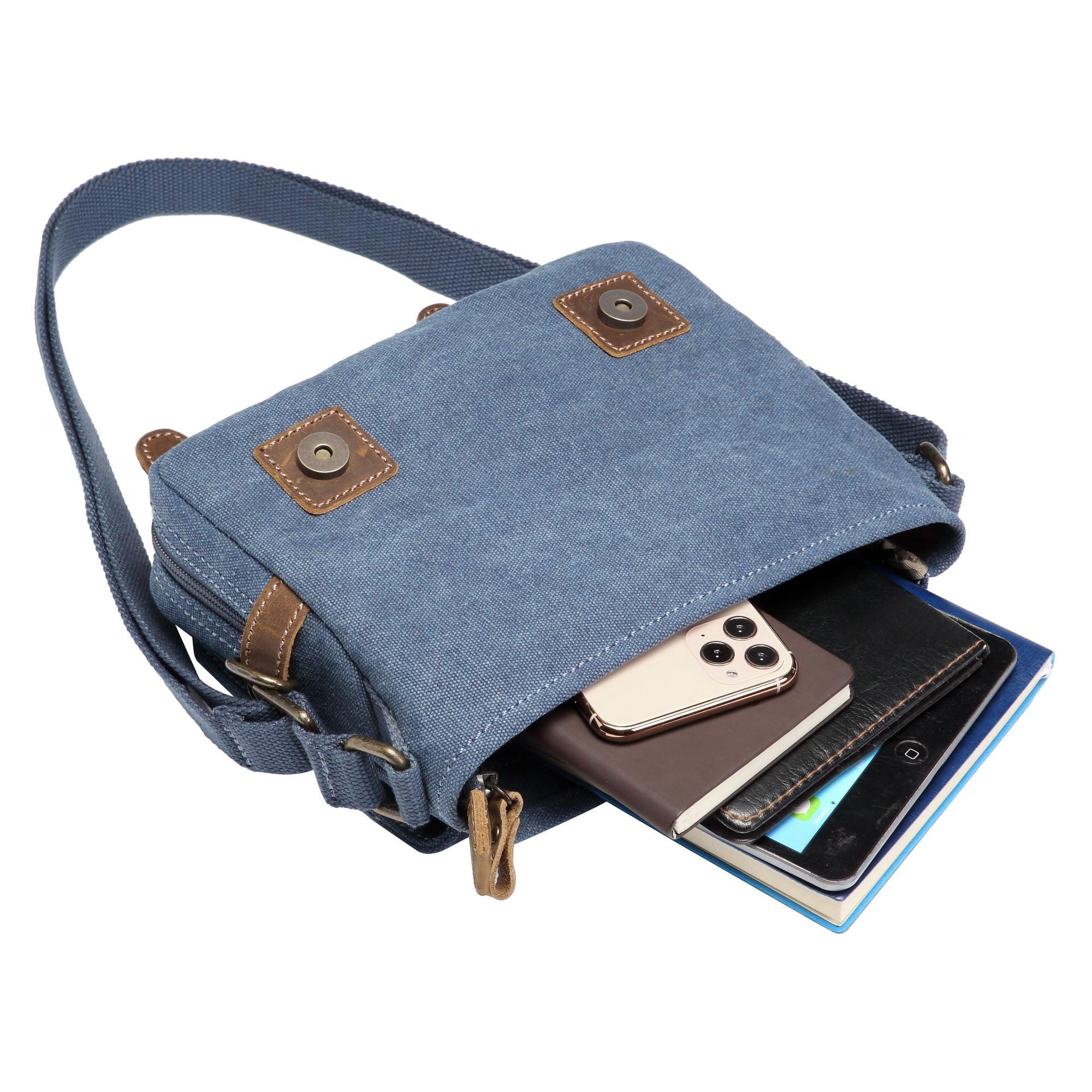 Blue Troop London across body bag with adjustable strap and front pocket, designed for convenient everyday carrying.