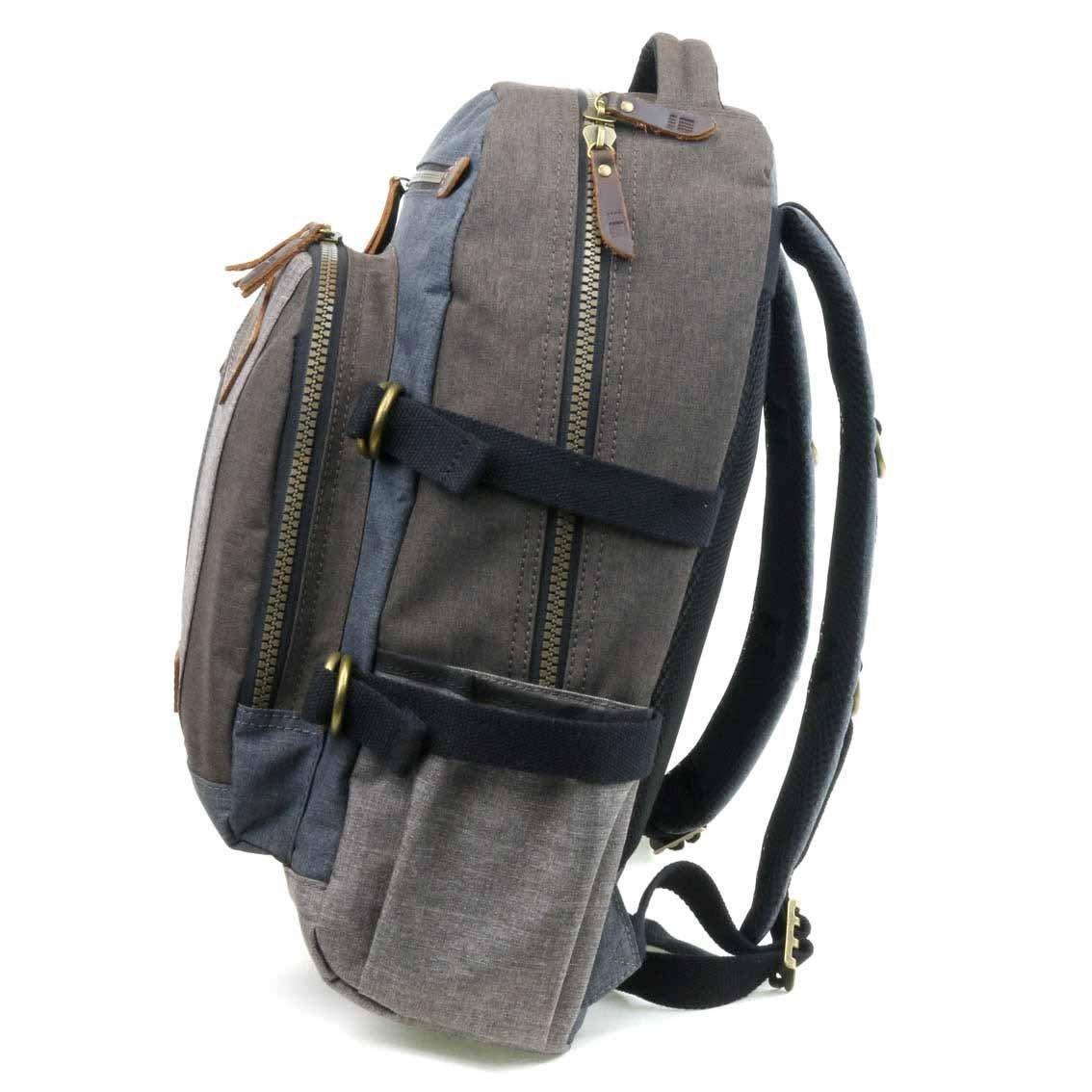 Troop London TRP0385 laptop backpack with multiple compartments, black fabric, and padded shoulder straps for comfortable carrying.