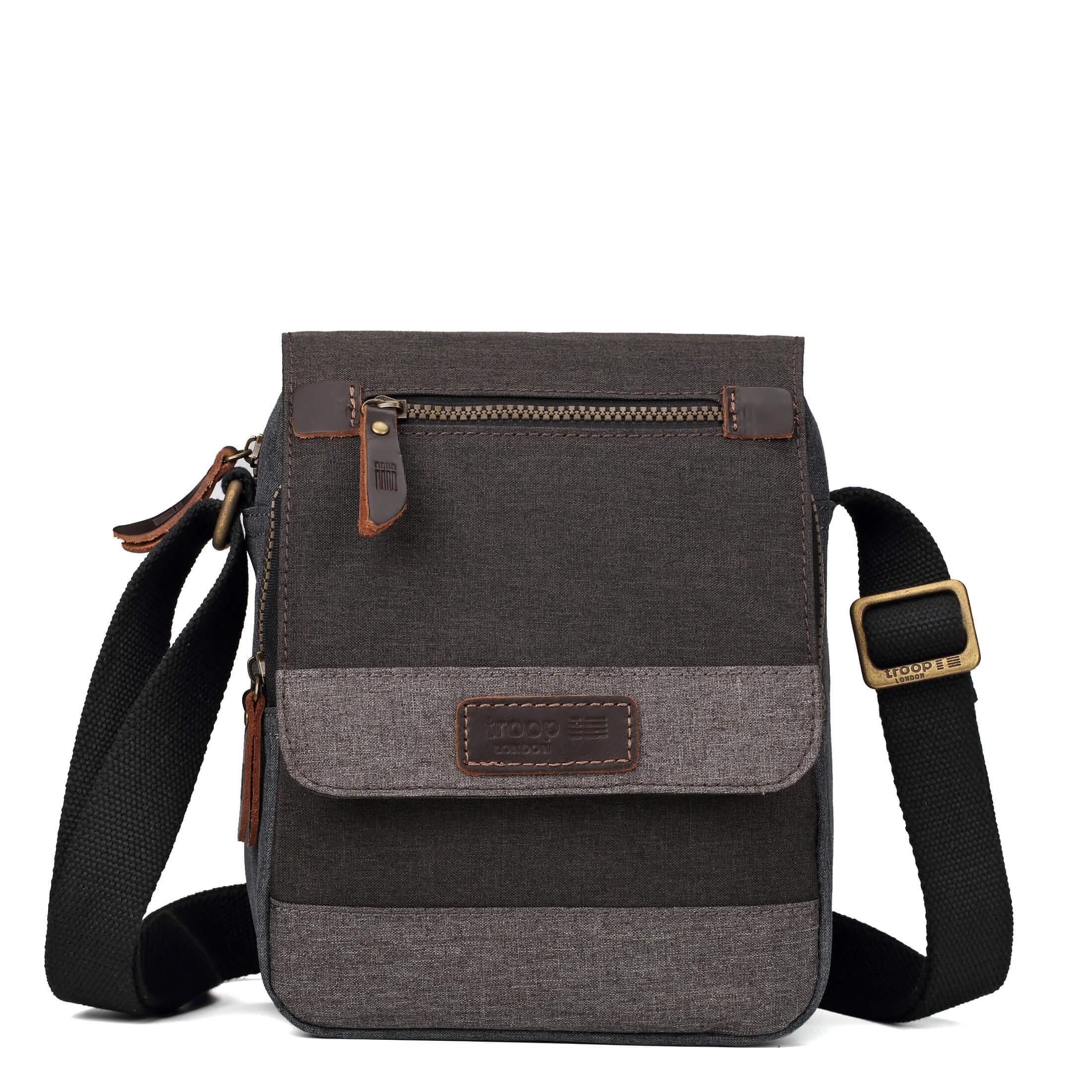 Grey Troop London crossbody bag with adjustable strap and front pocket, stylishly displayed on a neutral background.