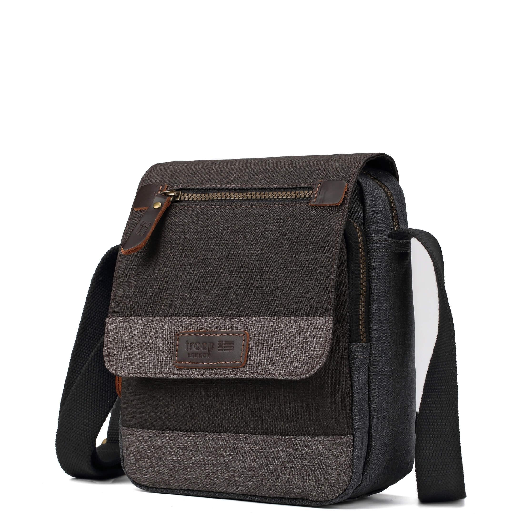 Gray Troop London crossbody bag with adjustable strap, showing its sleek design and compact size for everyday use.