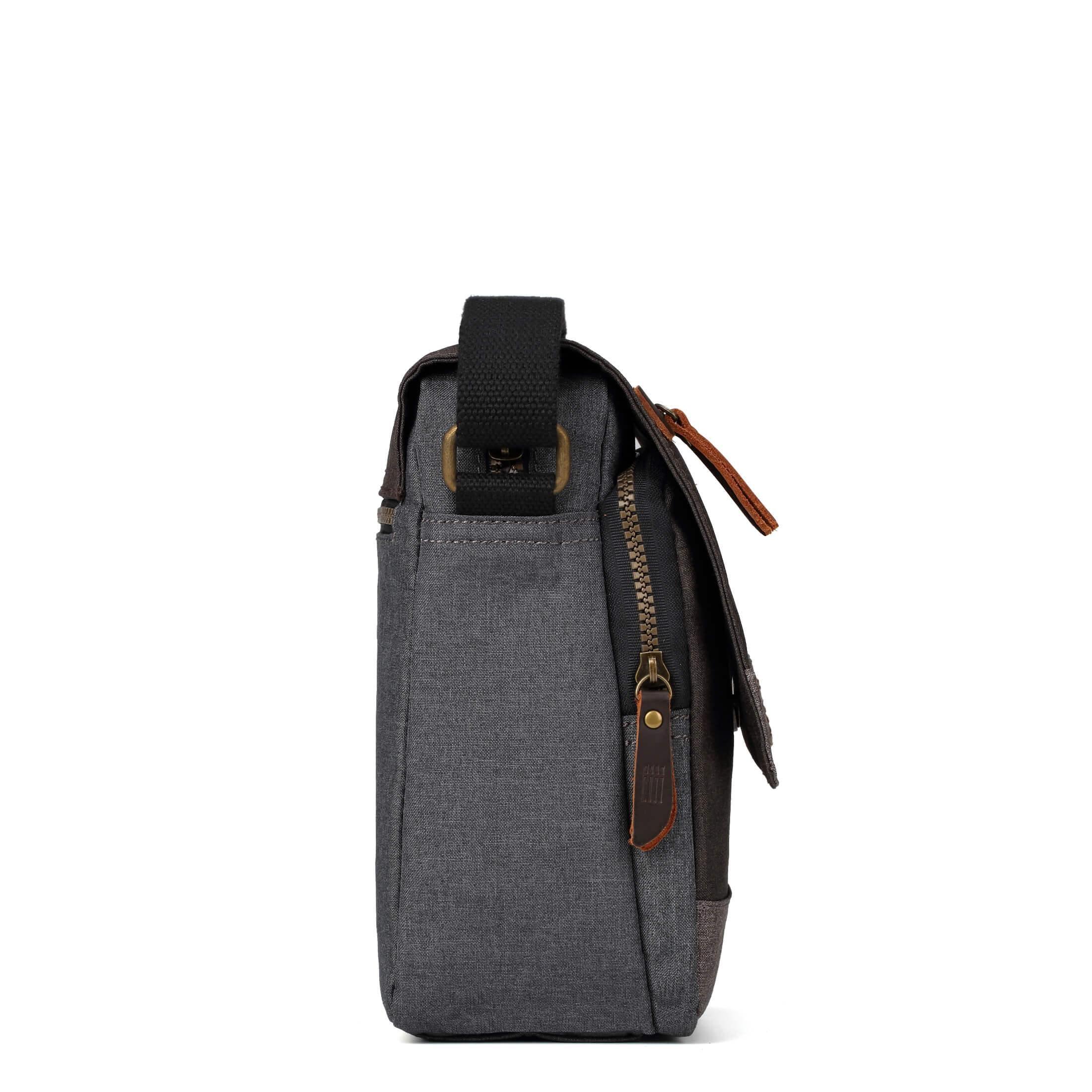 Grey Troop London crossbody bag with adjustable strap and spacious main compartment, stylishly displayed on a neutral background.