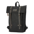 Black waxed canvas Troop London Heritage small backpack with adjustable straps and multiple compartments.