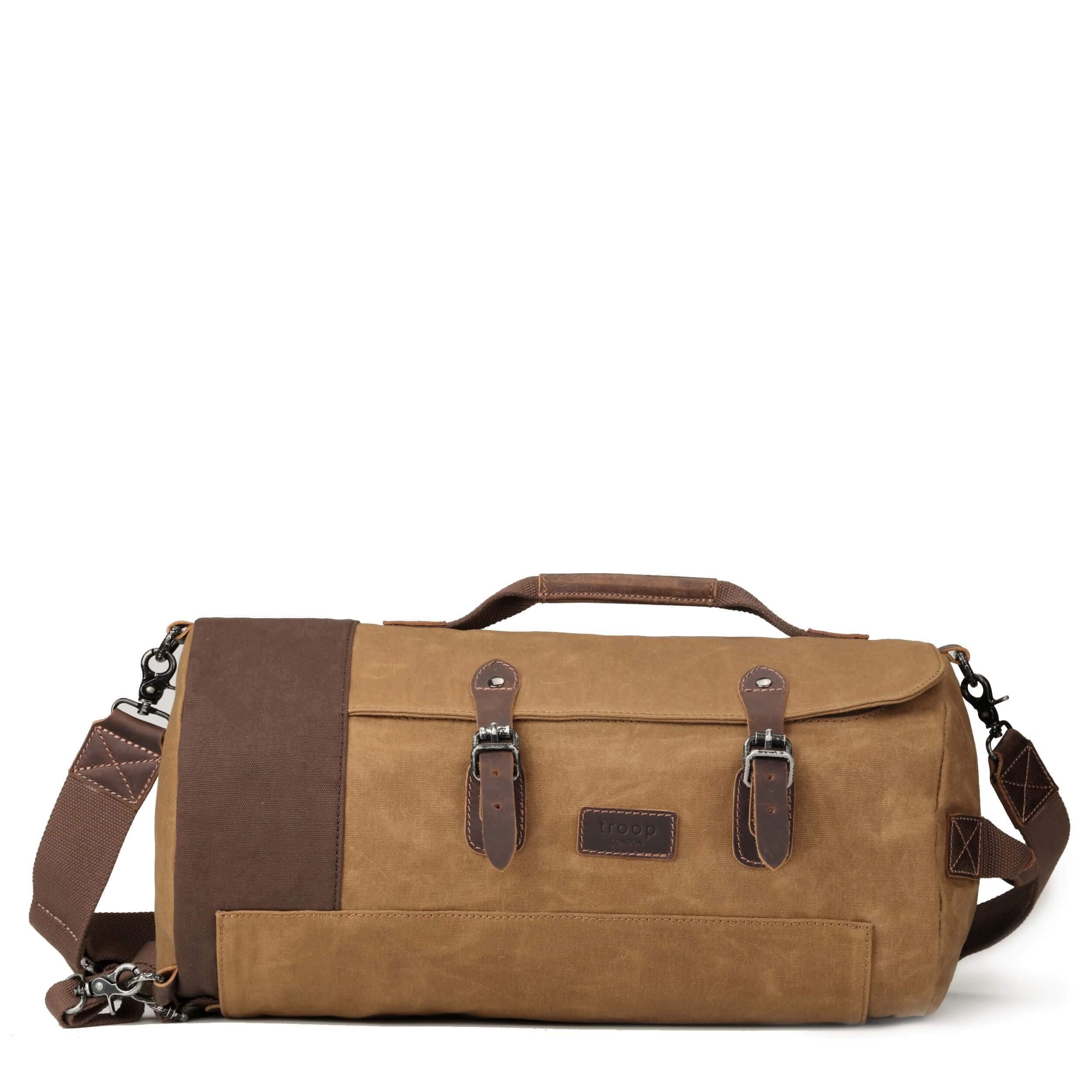 Troop London Heritage Duffel Backpack in camel color, a travel luggage holdall with sturdy straps and spacious interior.