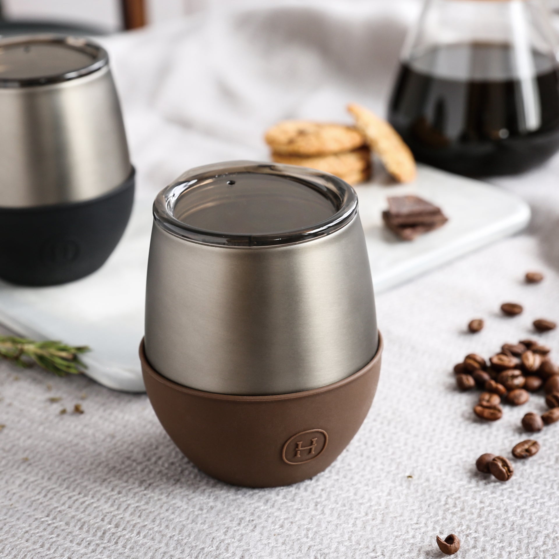 Titanium grey HYDY 8 oz mocha tumbler with a sleek design, stainless steel body, and spill-proof lid for hot and cold beverages.