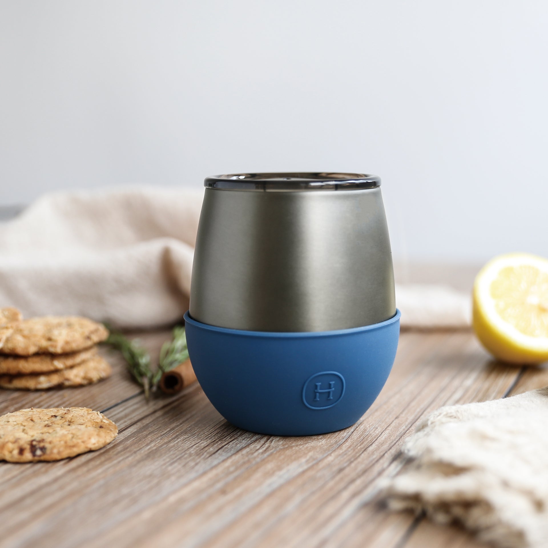 Hydy 8 oz titanium grey tumbler with navy blue lid, durable stainless steel travel mug for hot and cold beverages.