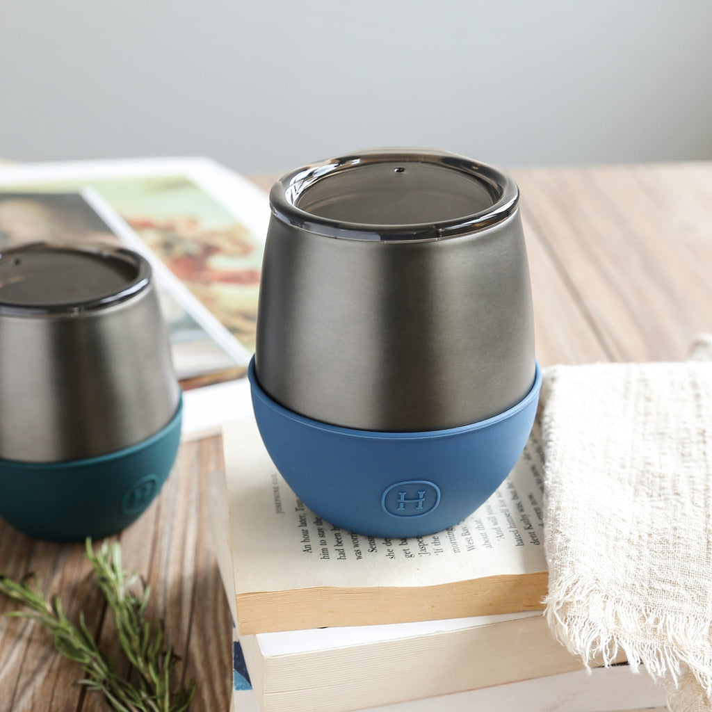 Titanium grey and navy blue HYDY 8 oz tumbler with sleek design and durable stainless steel construction.