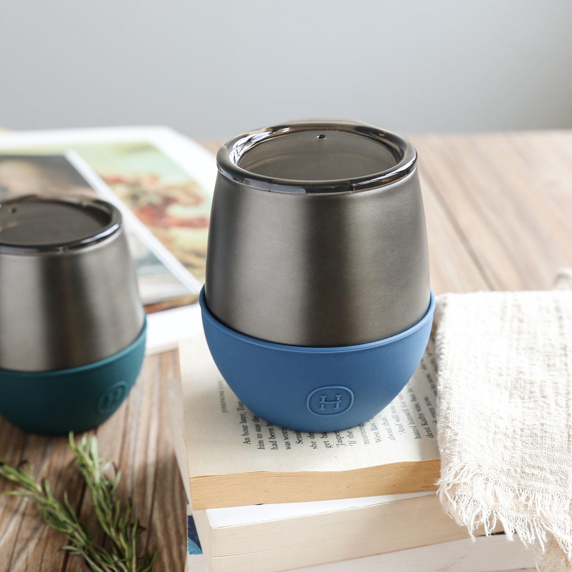 Titanium grey and navy blue HYDY 8 oz tumbler with sleek design and durable stainless steel construction.