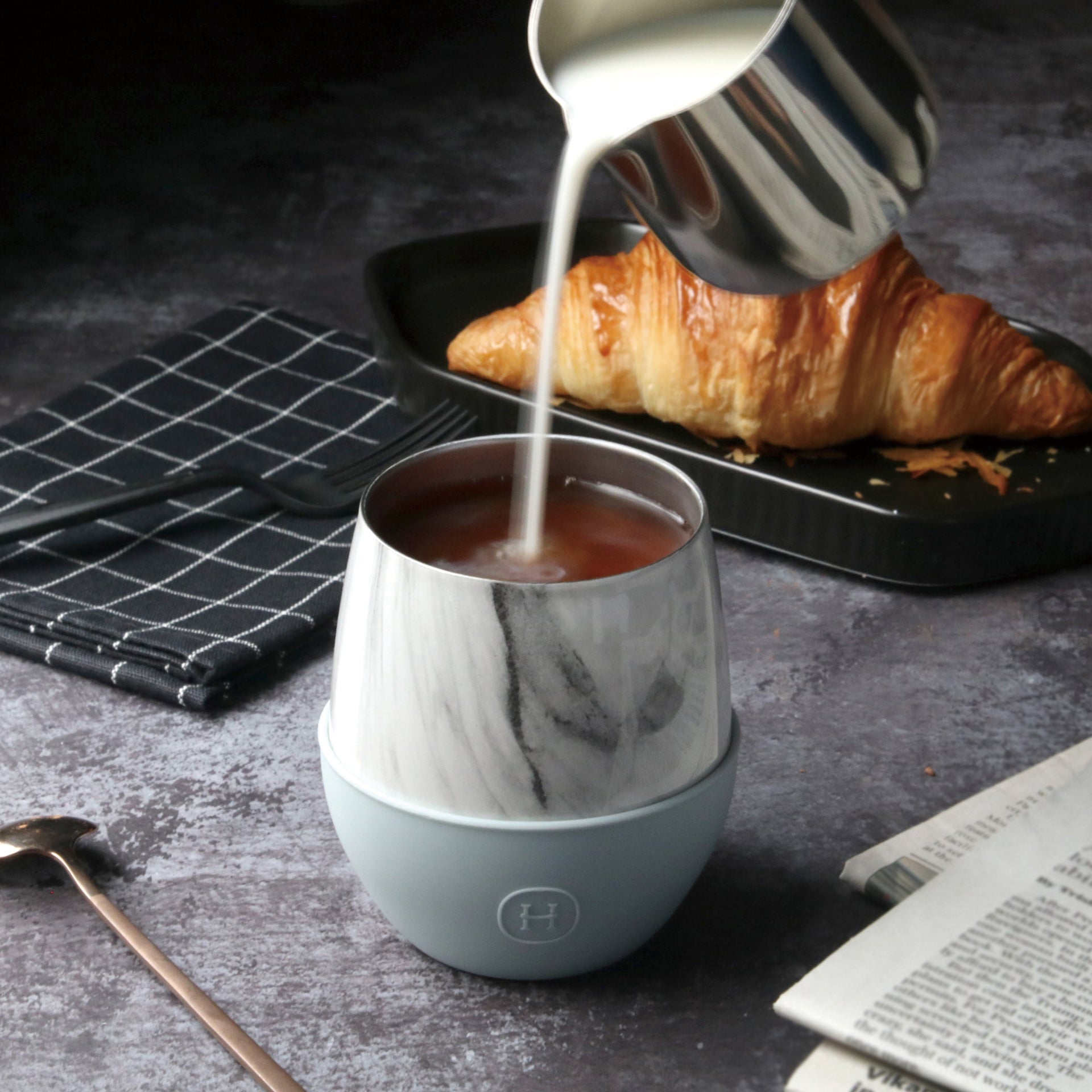 White marble HYDY Cumulus 8 oz tumbler with a sleek design and lid, perfect for hot or cold beverages.