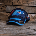 Uggly and Co Team Classic Suzuki trucker hat with adjustable snapback, featuring embroidered Suzuki logo on front.