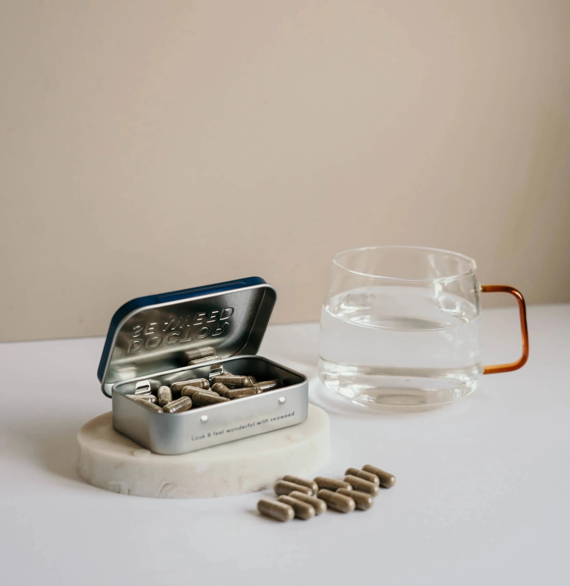 Refillable Doctor Seaweed supplement tin with a sleek metal container and secure lid, ideal for storing dietary supplements.