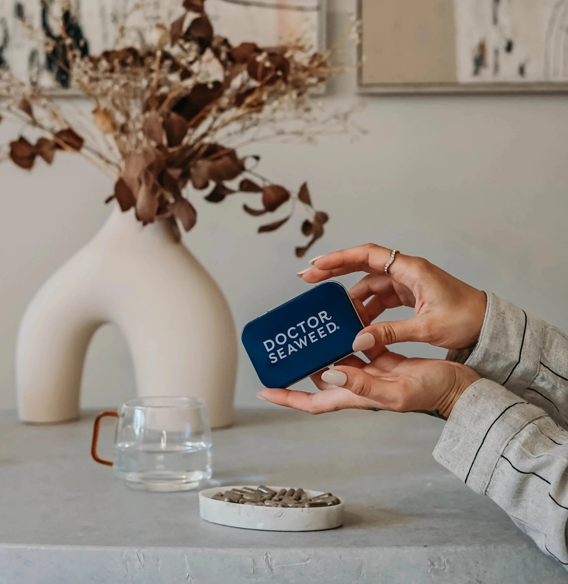 Refillable Doctor Seaweed supplement tin with a silver metal finish and secure lid, designed for storing dietary supplements or herbs.