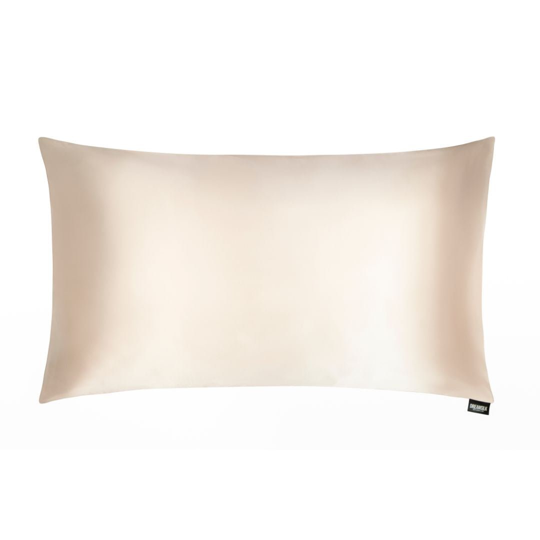DREAMSILK luxury silk pillowcase in smooth, shiny fabric with elegant stitching, designed for comfort and style.