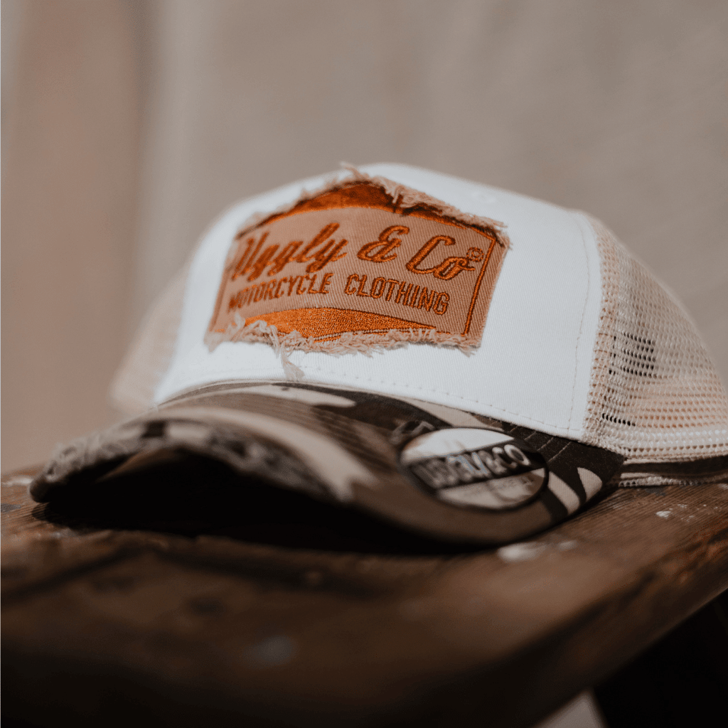 Uggly and Co camo diamond trucker hat with mesh back and curved brim, vintage style outdoor cap.