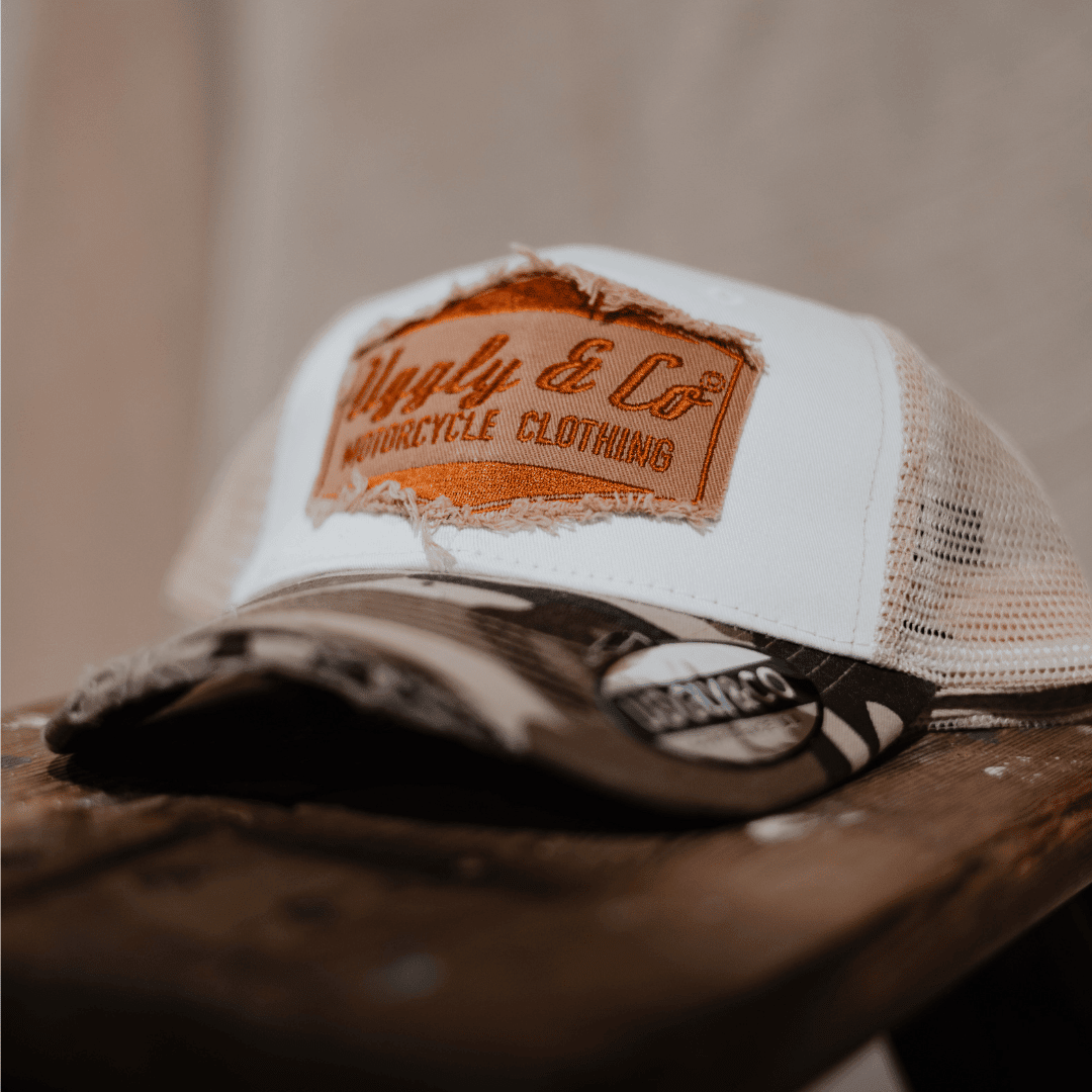 Uggly and Co camo diamond trucker hat with mesh back and curved brim, vintage style outdoor cap.