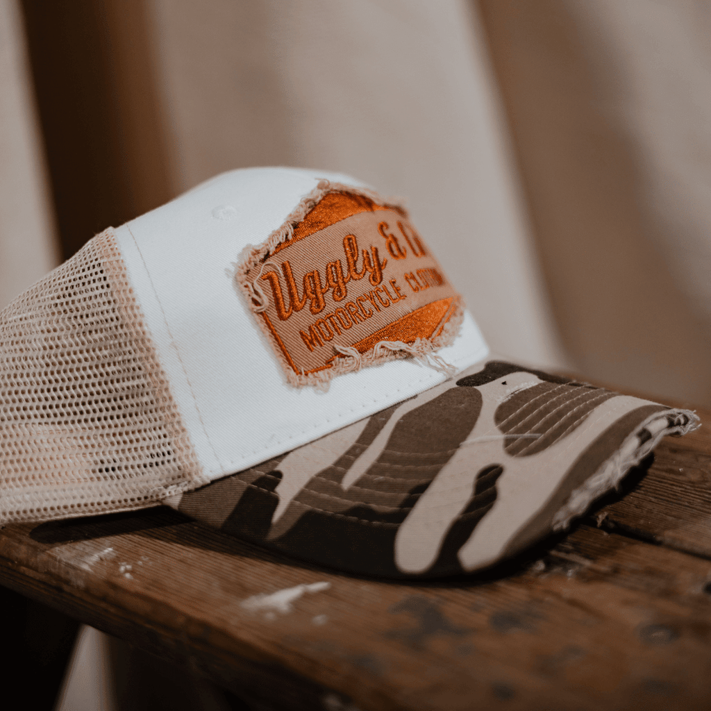 Vintage camouflage diamond trucker hat by Uggly and Co with mesh back and curved brim.
