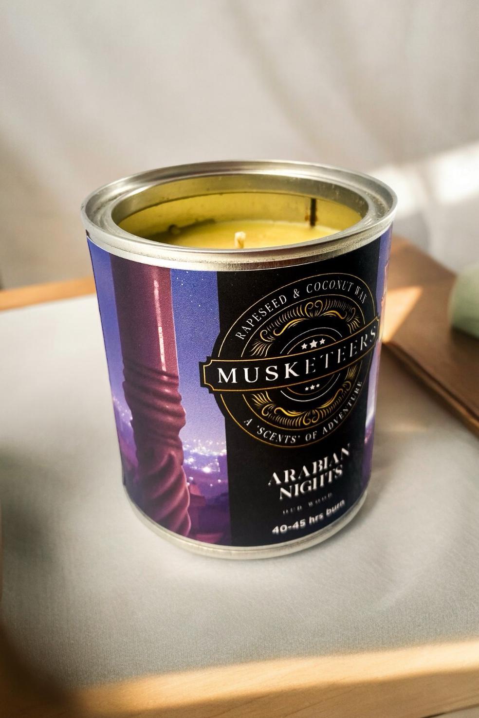 Arabian Nights Oud Candle by Musketeers, luxurious masculine candle with warm, aromatic scent, shown in a decorative container.