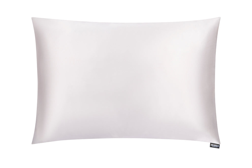 White luxury silk pillowcase by DREAMSILK, showcasing smooth, shiny silk fabric designed for comfort and elegance.