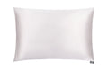 White luxury silk pillowcase by DREAMSILK, showcasing smooth, shiny silk fabric designed for comfort and elegance.