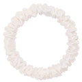 White silk scrunchie by DREAMSILK, skinny style, soft and smooth fabric perfect for gentle hair styling.