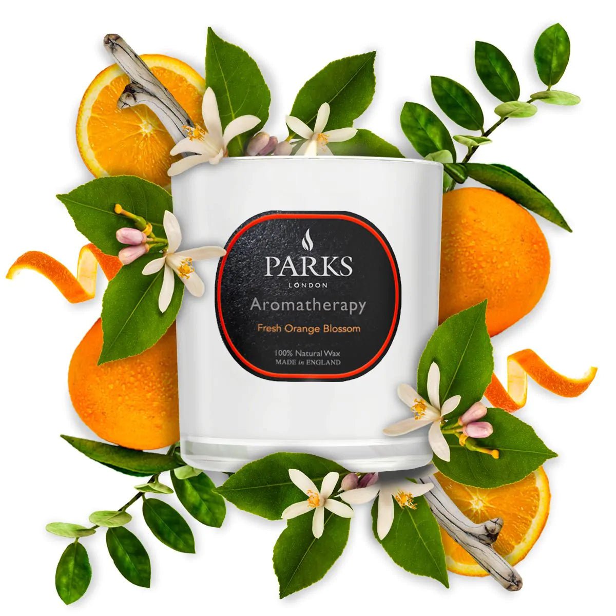 Fresh orange blossom candle by Parks Candles, 220g, with a white wax surface and a lit cotton wick, in a clear glass jar.