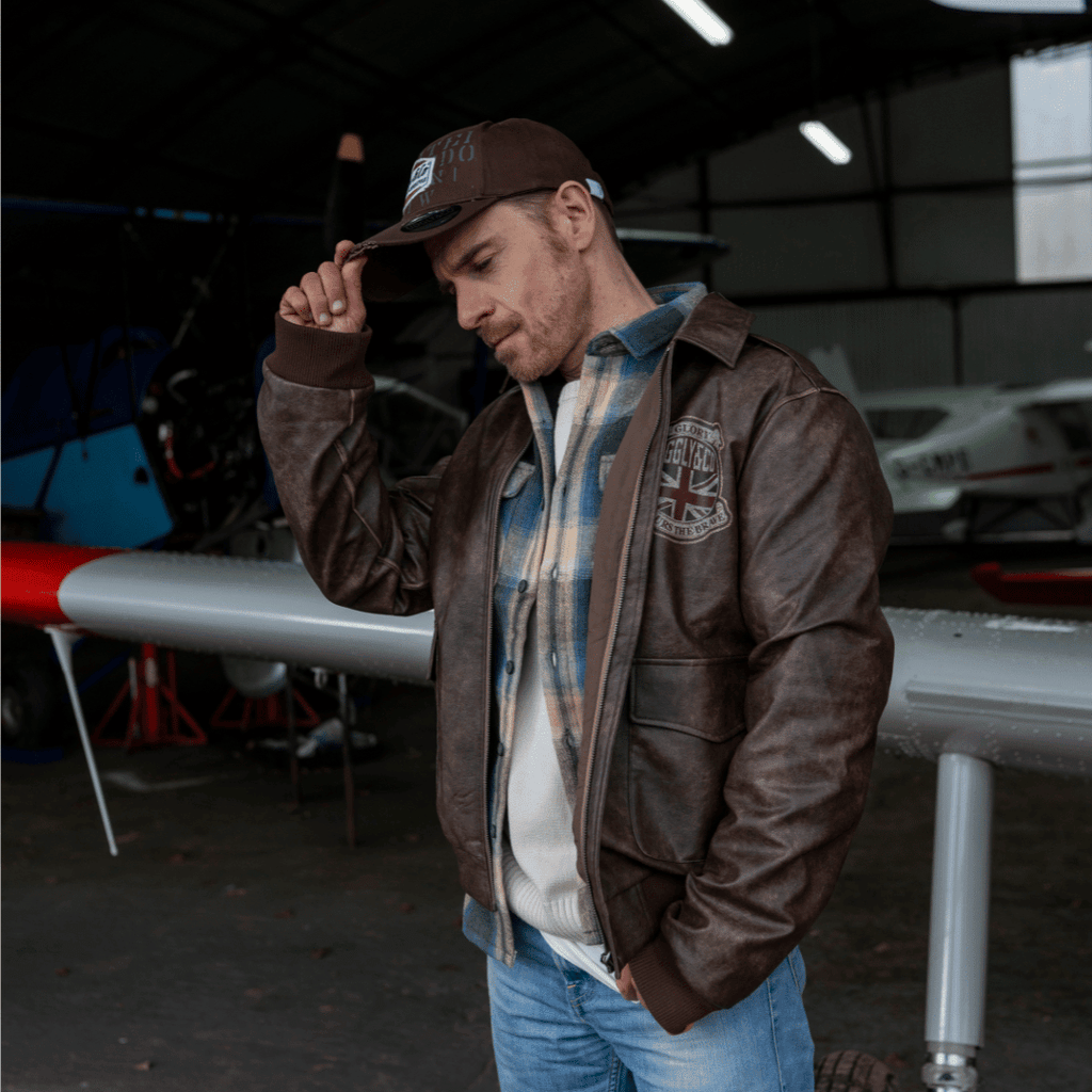Brown Uggly and Co Aviation Diamond Trucker Hat featuring a baseball cap style with embroidered diamond logo and adjustable mesh back.