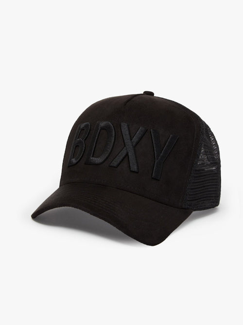 Black "The Gaffer" trucker cap by BDXY Studios with mesh back and curved brim, displayed on a plain background.