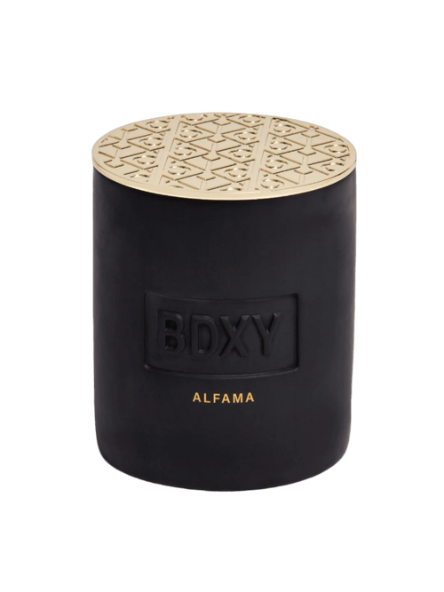 BDXY Studios Alfama scented candle with a sleek glass jar and minimalist design, emitting a warm, inviting glow.