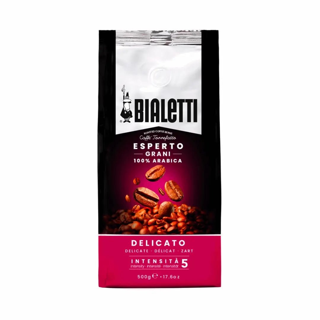 Bialetti Whole Bean Coffee by Brew Italia with fresh, roasted coffee beans in a clear bag, showcasing the Delicato blend.