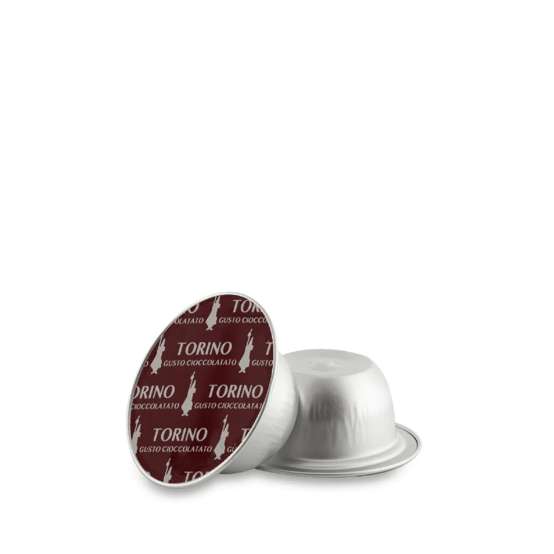 Bialetti Caffe’ d’Italia Coffee Capsules for Gioia, Brew Italia brand, shown in a close-up image of the coffee capsules.