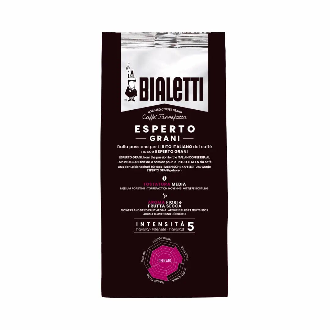 Bialetti Brew Italia Delicato whole bean coffee with light brown beans in a clear glass jar on a white background.