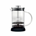 Bialetti Tuttocrema glass milk frother for creating frothy milk for coffee, with a clear glass body and stainless steel handle.