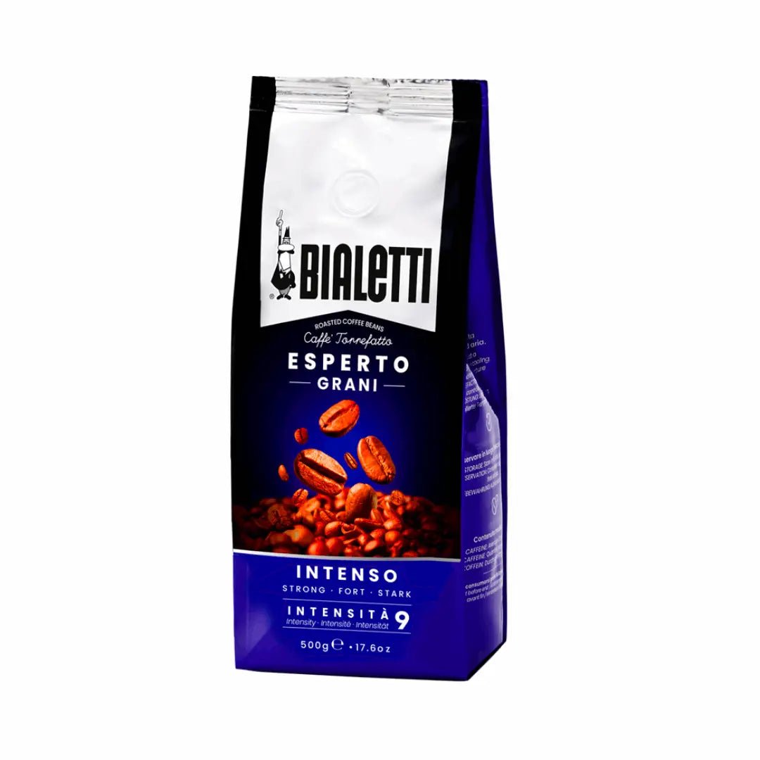 Bialetti Brew Italia Intenso whole bean coffee in a bag with roasted coffee beans and a scoop, ready for brewing.