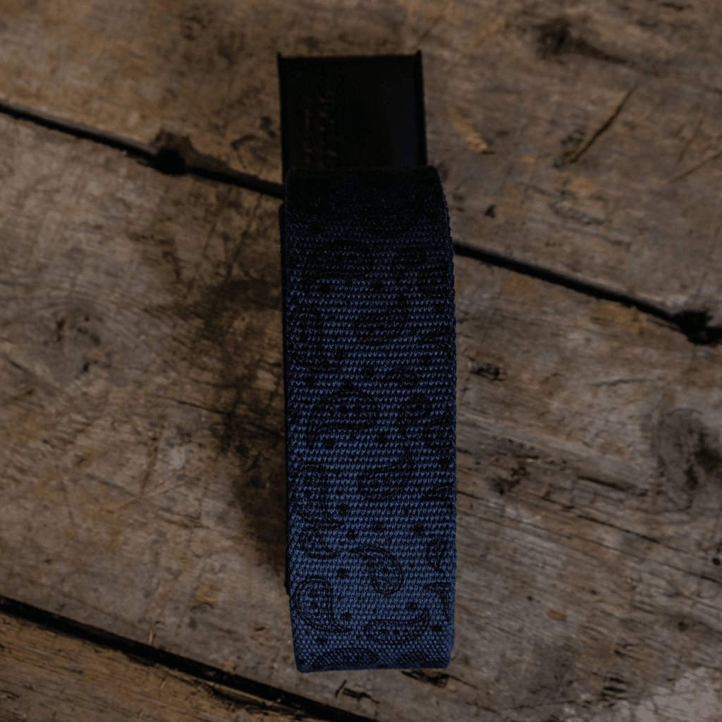 Blue canvas utility belt with adjustable straps, designed for accessories and casual wear by Uggly and Co.