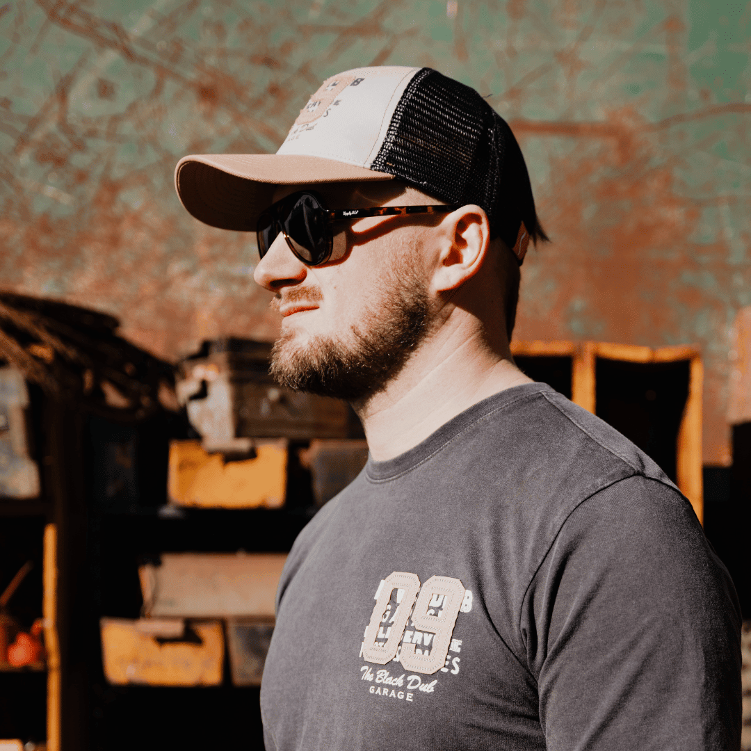 Uggly and Co Stone Parts & Spares '09' trucker hat with a structured mesh back and bold front logo design.