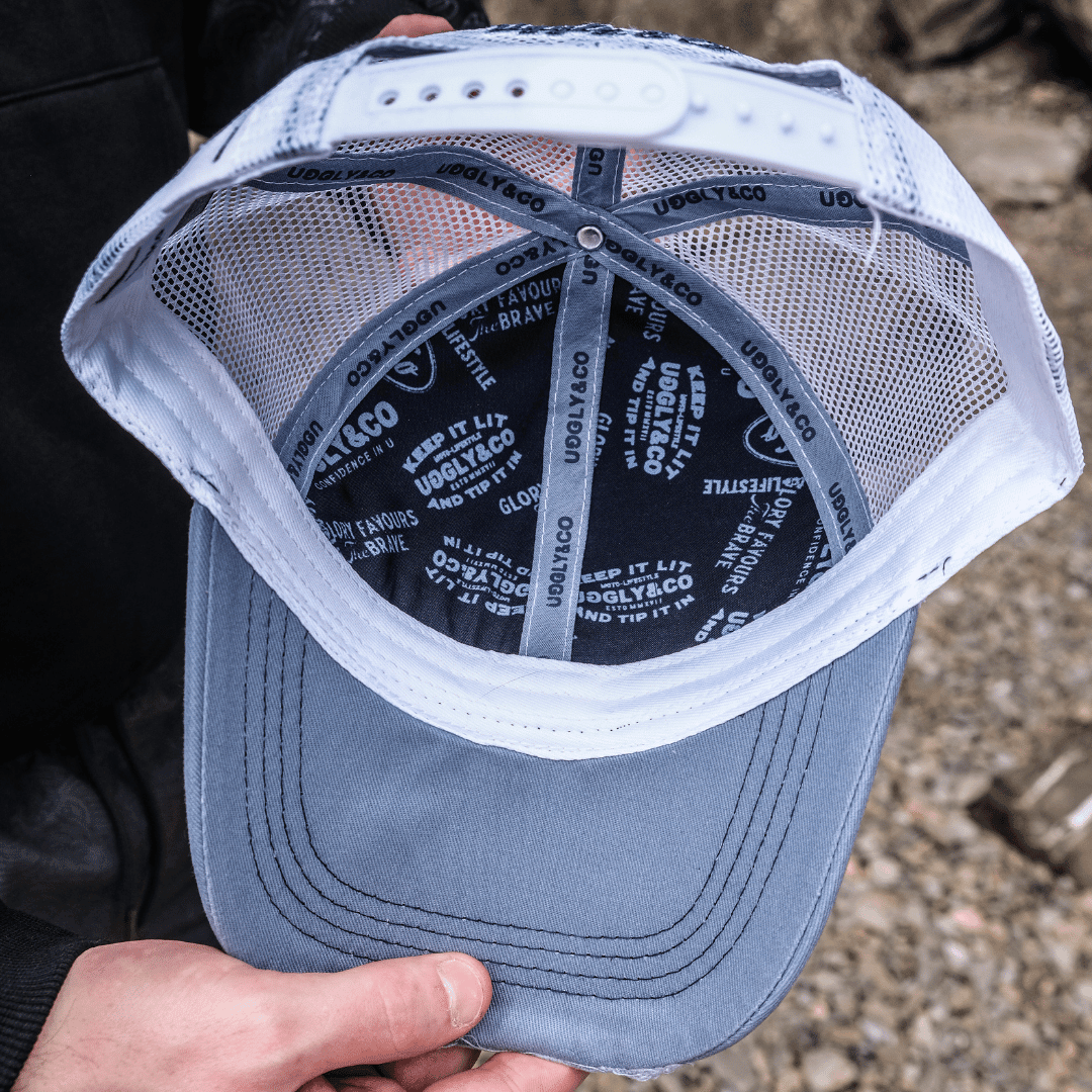 Blue Surf Diamond Trucker Cap by Uggly and Co featuring a classic trucker style with a blue color and diamond design on the front panel.