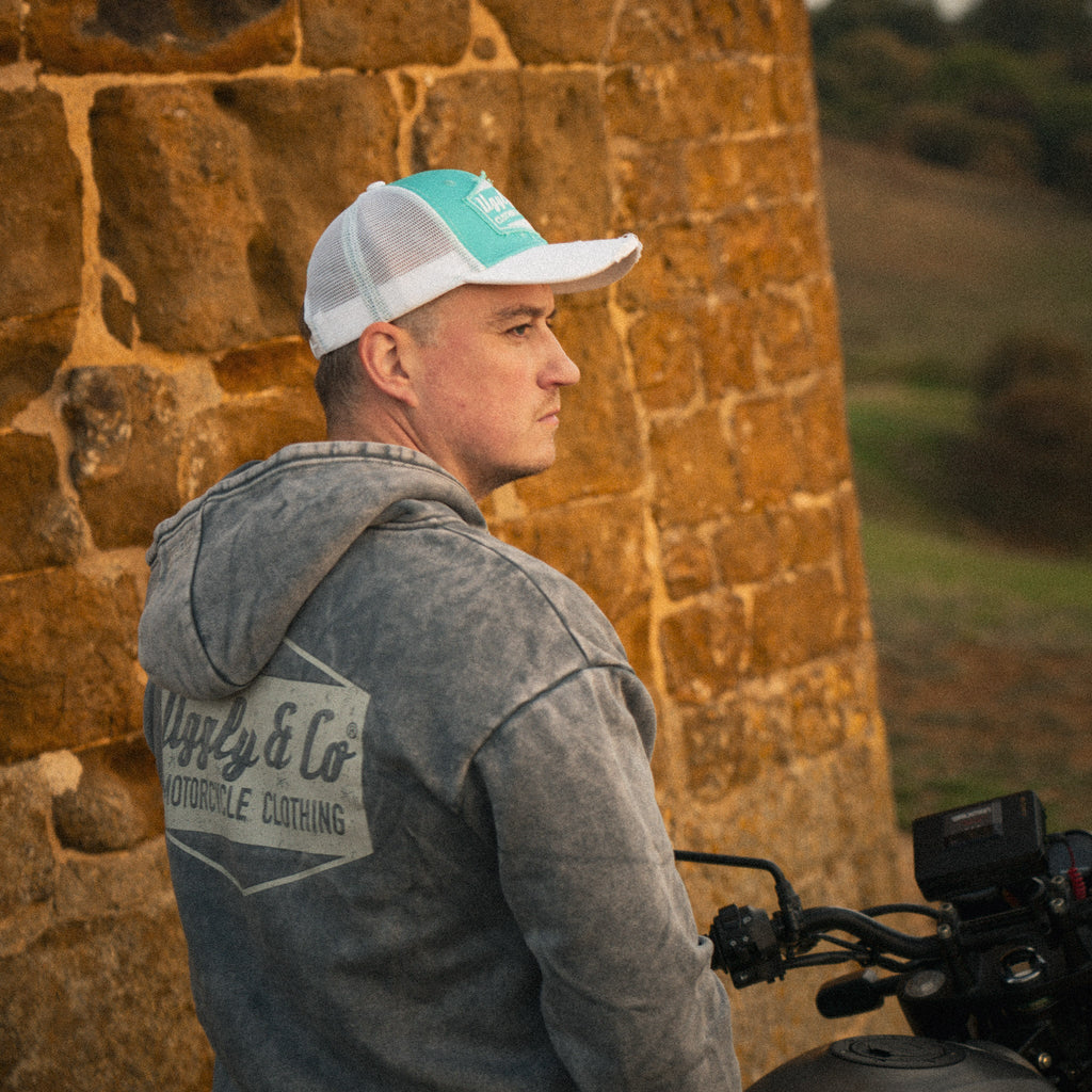 Turquoise and white diamond trucker cap by Uggly and Co featuring a classic biker-style design and adjustable mesh back.