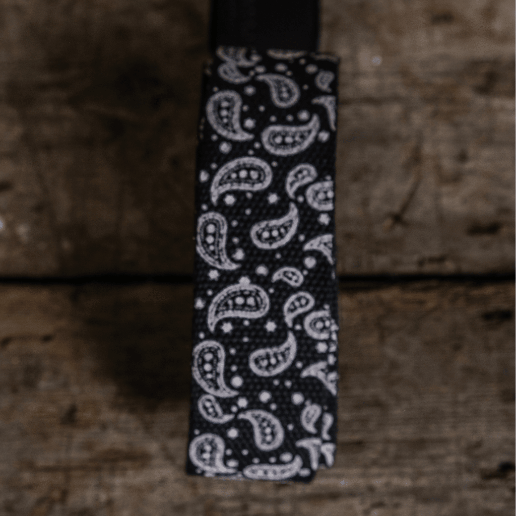 Black canvas utility belt by Uggly and Co featuring multiple pockets and adjustable strap for versatile accessories.