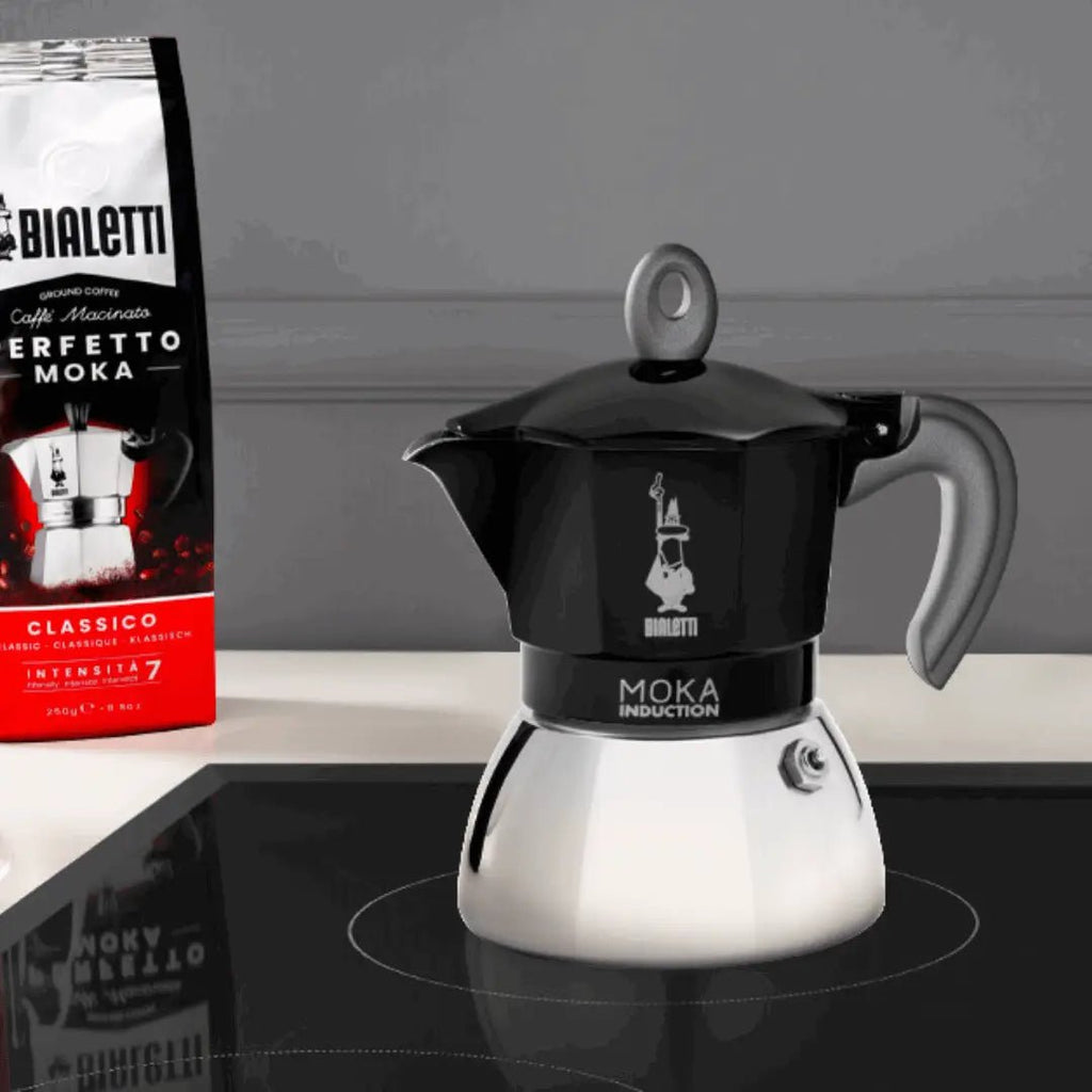 Black Bialetti Moka induction stovetop coffee maker with Brew Italia branding, designed for brewing rich espresso-style coffee.