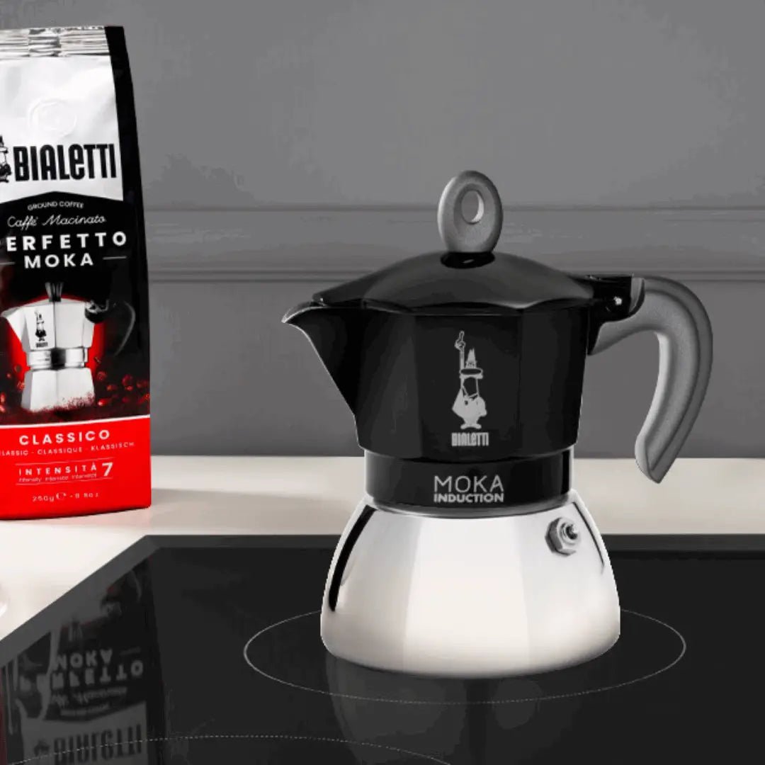 Black Bialetti Moka induction stovetop coffee maker with Brew Italia branding, designed for brewing rich espresso-style coffee.