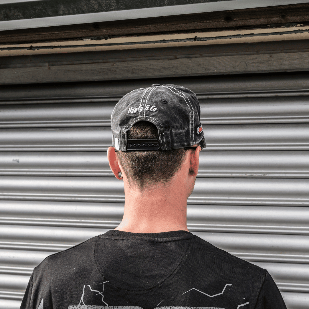 Uggly and Co Diamond Trucker Hat featuring Bradley Ray #28 logo, displayed on a trucker cap with a race bike graphic.