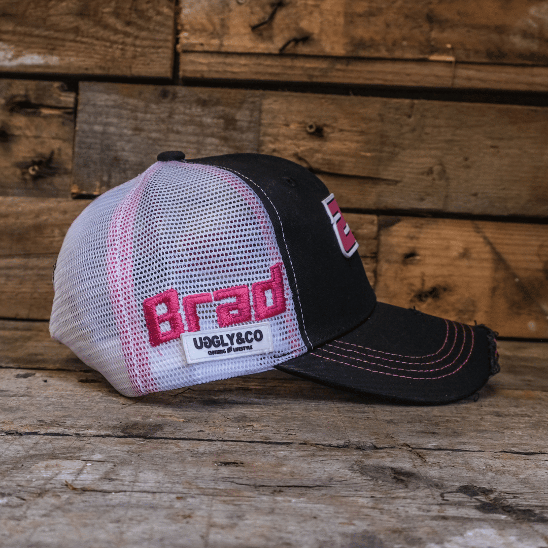 Uggly and Co Bradley Ray #28 trucker cap with mesh back and adjustable strap, featuring bold embroidered logo on front.