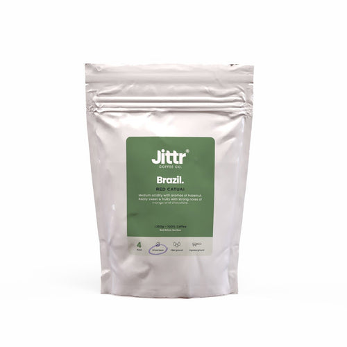 Brazil Single Origin coffee beans from Jittr Coffee Co, 250g bag, showcasing dark roasted beans with rich aroma and glossy surface.