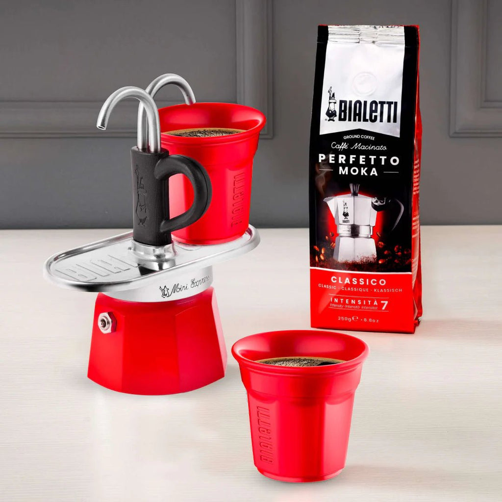 Bialetti Mini Express 'R' double serve coffee maker by Brew Italia, compact 2-cup espresso machine, black plastic and stainless steel.
