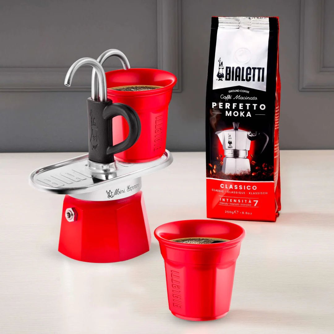 Bialetti Mini Express 'R' double serve coffee maker by Brew Italia, compact 2-cup espresso machine, black plastic and stainless steel.