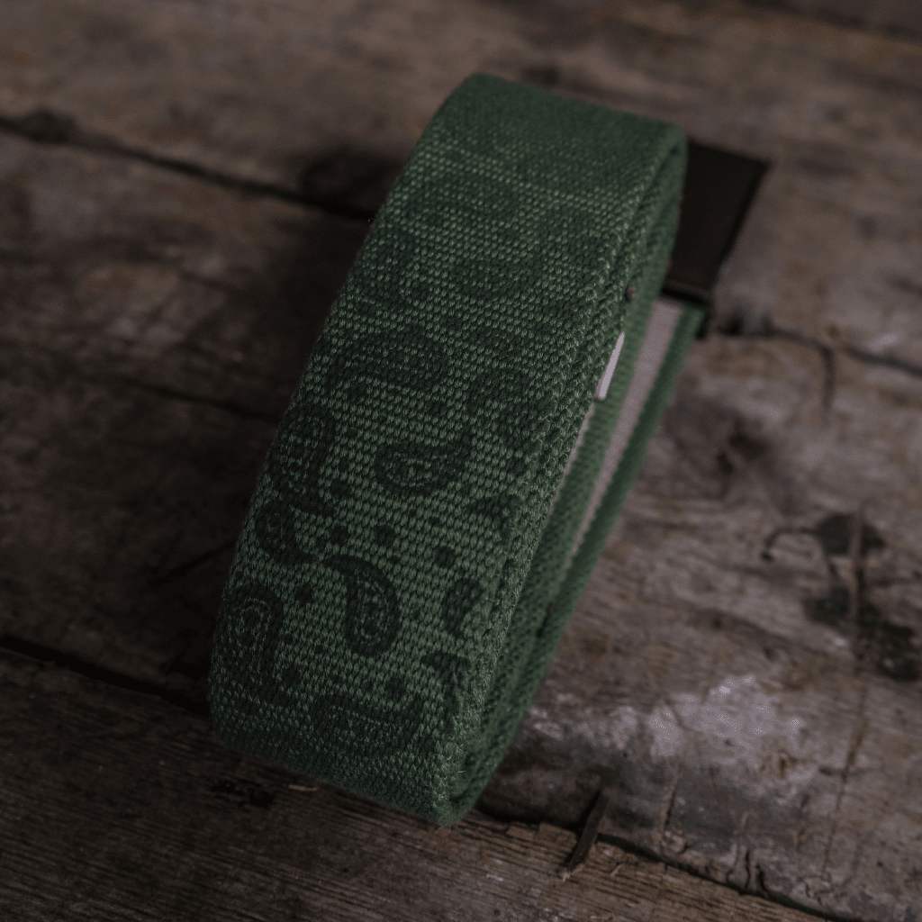 Green canvas utility belt from Uggly and Co with adjustable strap and multiple pouches for practical accessories.