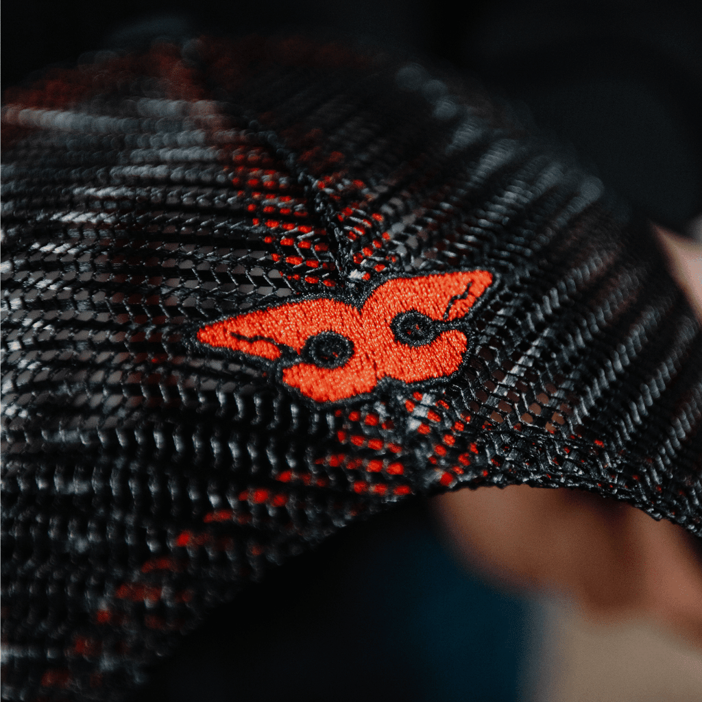 Uggly and Co Carl Cox Icon Trucker Hat featuring a mesh back and bold logo embroidery on the front.