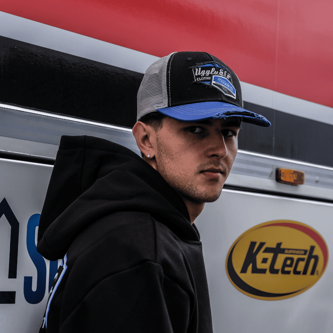 Uggly and Co Cheshire Mouldings x TAS Racing diamond trucker hat with embroidered logo and mesh back, casual style.