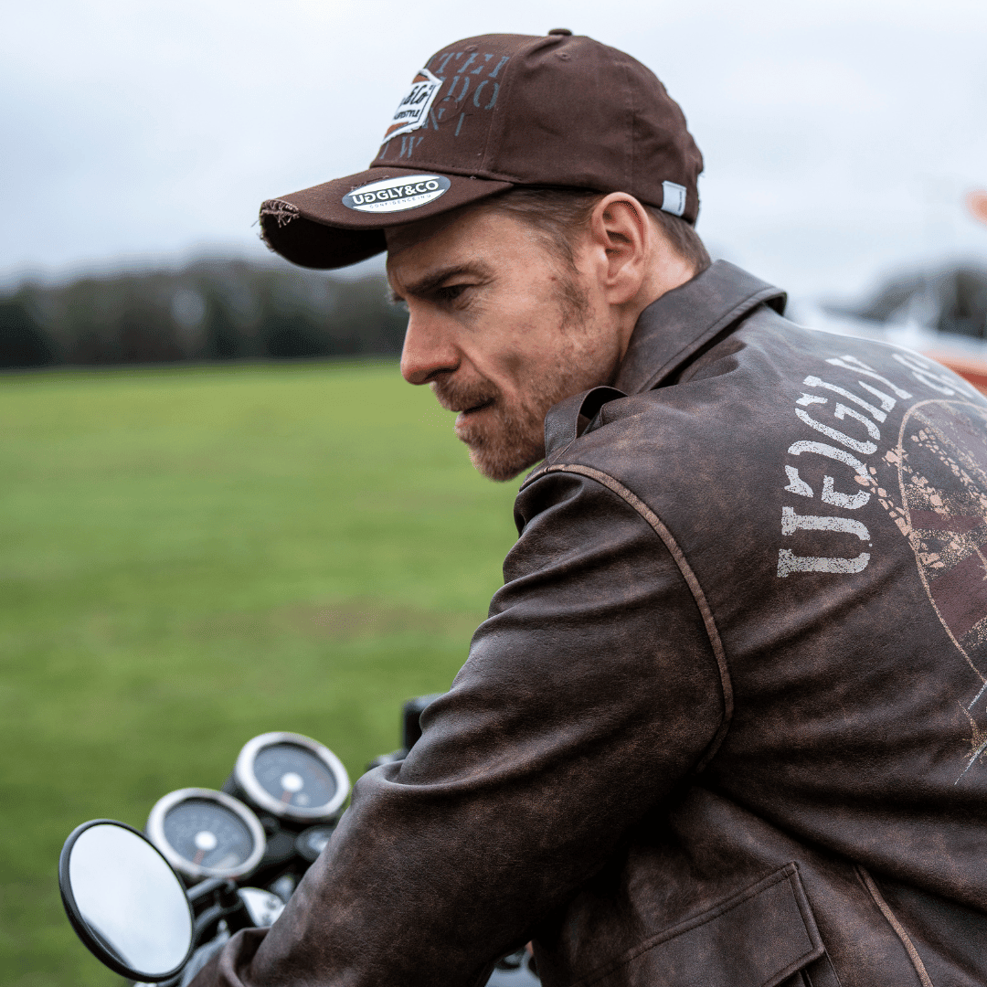 Brown Uggly and Co aviation diamond trucker hat featuring a classic motorcycle t-shirt design on the front.